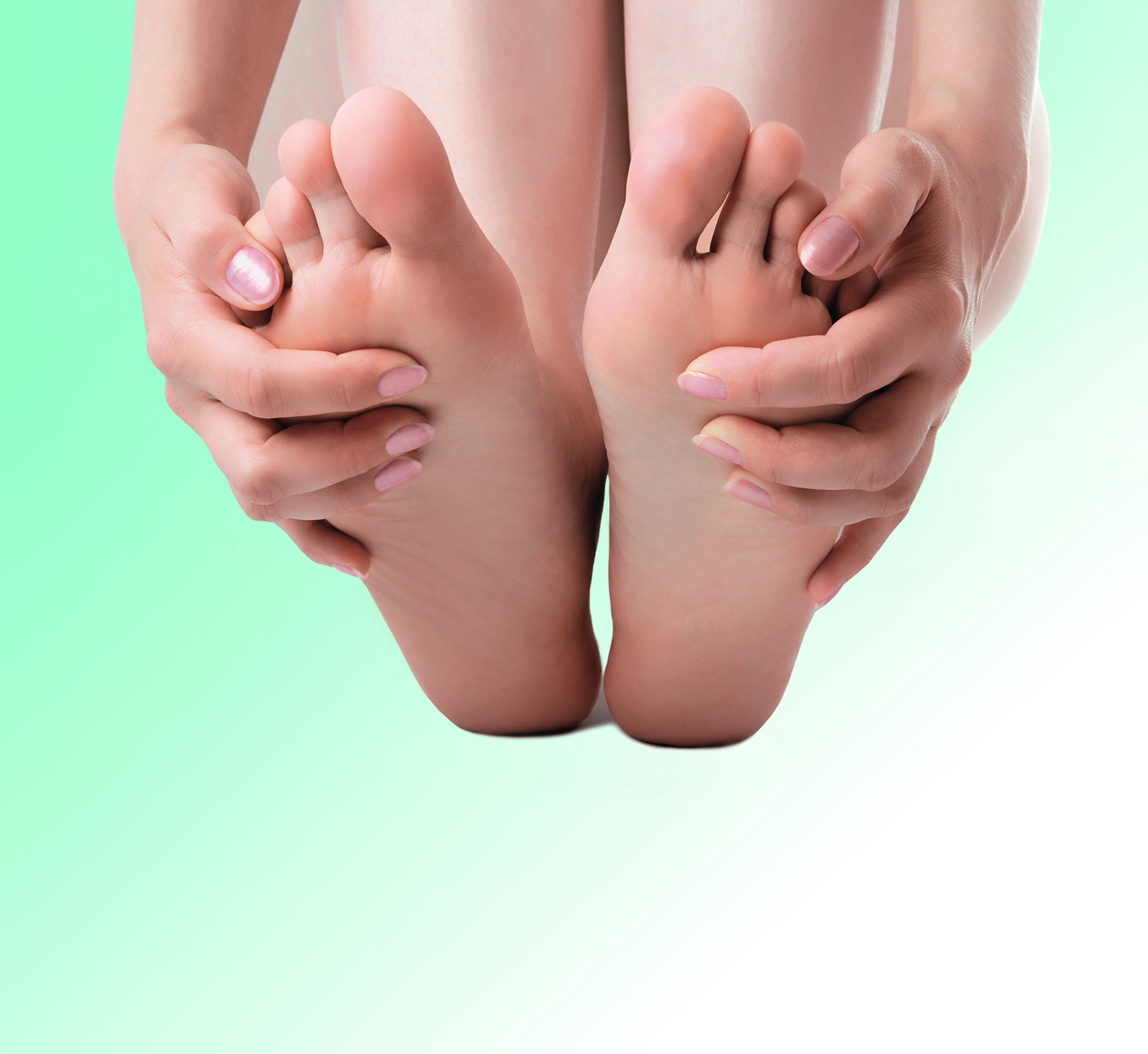 woman massage feet on white